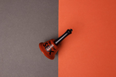 Bell for sex on red and black. For calls for intercourse. Grey colourの写真素材