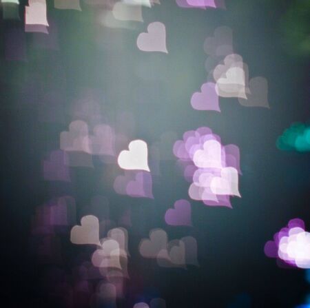 Blurred valentine background with heart-shaped highlightsの写真素材