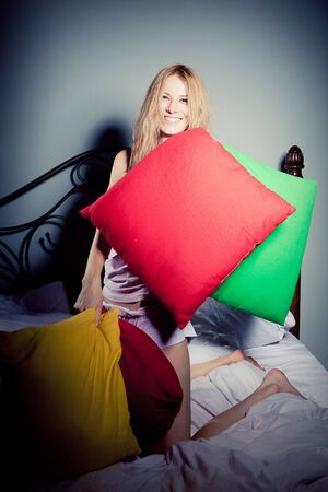 Girl and pillowsの写真素材