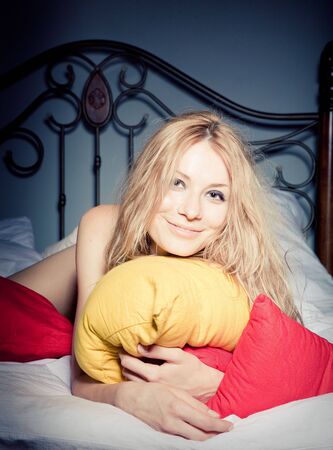 The girl and pillowsの写真素材