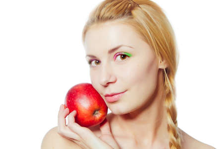 portrait of  young woman with red apple isolated on whiteの写真素材