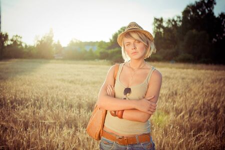 Image of young woman on wheat field