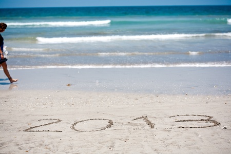 New year background of beach with  2013  drawn in the sand の写真素材