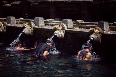 holy spring water in tirta empul, bali, indonesiaのeditorial素材
