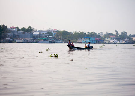 SOC TRANG, VIETNAM - JAN 28 2014: Unidentified man rowing boats in Mekong Delta. On JAN 28, 2014.のeditorial素材