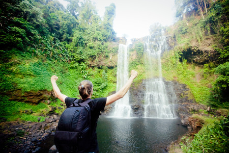 Winner near waterfall. Sport and active life conceptの写真素材