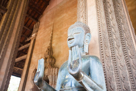 VIENTIANE, LAOS - FEB 2: Bronze Buddha statue at the Haw Phra Kaew, Vientiane, Laos on Feb 14, 2014. The Haw Phra Kaew is a former temple in Laos.の写真素材