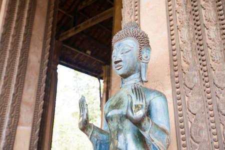 VIENTIANE, LAOS - FEB 2: Bronze Buddha statue at the Haw Phra Kaew, Vientiane, Laos on Feb 14, 2014. The Haw Phra Kaew is a former temple in Laos.のeditorial素材