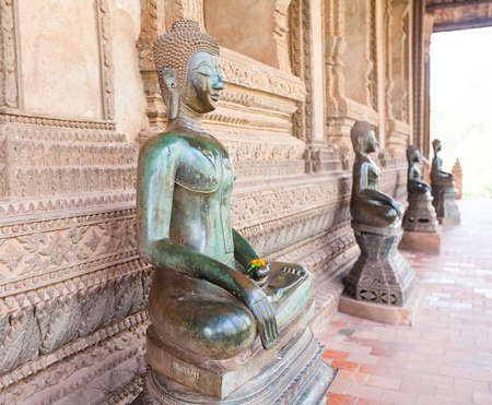VIENTIANE, LAOS - FEB 2: Bronze Buddha statue at the Haw Phra Kaew, Vientiane, Laos on Feb 14, 2014. The Haw Phra Kaew is a former temple in Laos.のeditorial素材