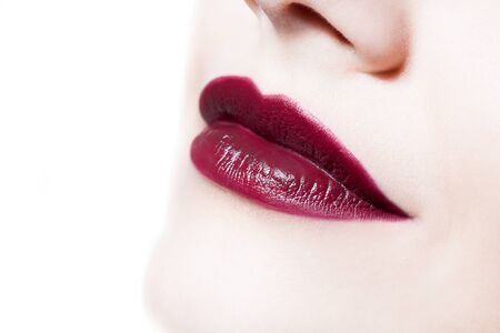 closeup portrait of  woman's  dark red  color lipsの写真素材