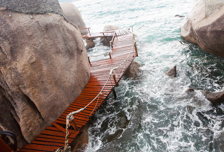 The way between rocks stones in the seaの写真素材