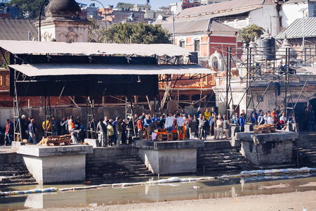 KATHMANDU, NEPAL-FEBRUARY 7, 2017: Hindu ritual of cremation in the temple. Pashupatinath listed in UNESCO World Heritage Sites is one of the most significant Hindu temples of Shiva in the world.のeditorial素材