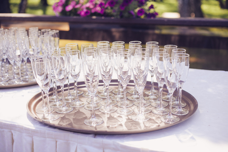 A set of glasses on the table at restaurant before partyの写真素材