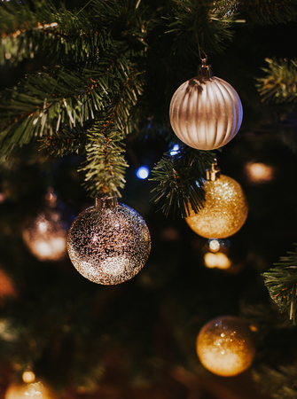 Decorated Christmas tree on blurred, sparkling and fairy backgroundの写真素材