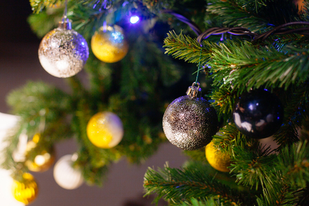 Decorated Christmas tree on blurred, sparkling and fairy backgroundの写真素材