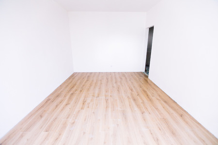 Photo of a white empty scandinavian room interior with wooden floor and walls. Home nordic interior.の写真素材