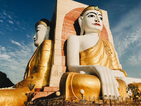 The Kyaik Pun Pagoda consists of four giant statues of Buddha, surrounded by Planetary posts, small shrines and image houses, Bago, Myanmarの写真素材