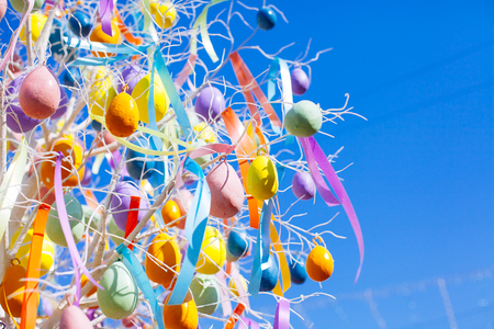 Easter eggs hanging  on tree branches