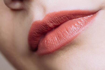 Beautiful closeup female plump lips with bright color makeup. Beauty conceptの写真素材