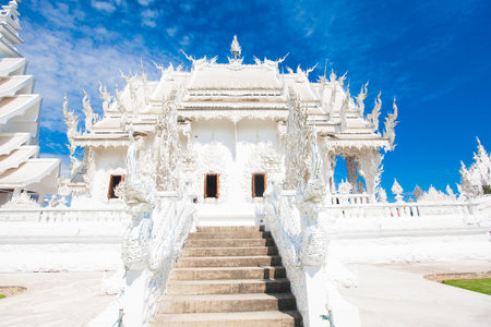 Famous Thailand temple or grand white church Call Wat Rong Khun, at Chiang Rai province, northern Thailandの写真素材
