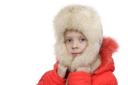 The girl in a fur cap on a white backgroundの写真素材