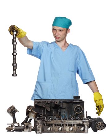 The person holds a detail of the engine in a hand,details of the engine on a white background
の写真素材