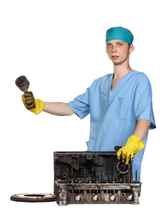 The person holds a detail of the engine in a hand,details of the engine on a white backgroundの写真素材