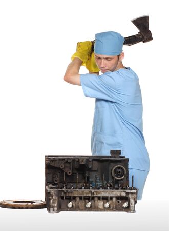 The person cuts with an axe the engineの写真素材