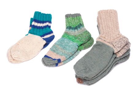 Different woolen socks on a white backgroundの写真素材