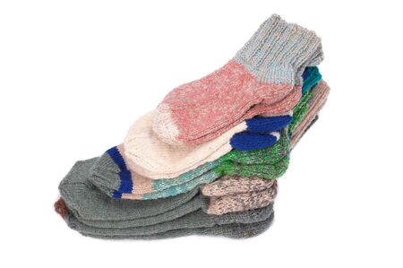 Pile of woolen socks on a white background