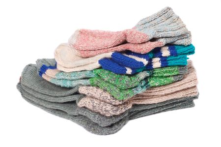 Pile of woolen socks on a white backgroundの写真素材