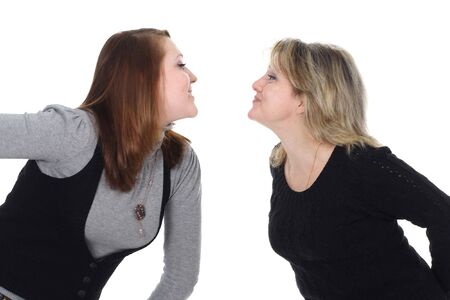Two women look against each other and smileの写真素材