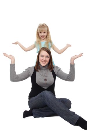 The young woman and the girl pose in an identical poseの写真素材