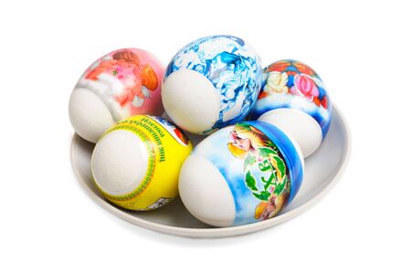 Easter eggs on a plate are isolated on a white backgroundの写真素材