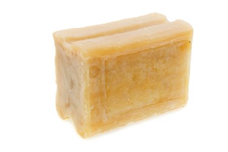 The piece of soap is isolated on a white backgroundの写真素材