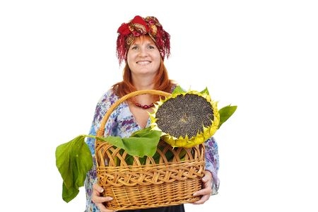 The woman with a basket and sunflower on a white backgroundの写真素材