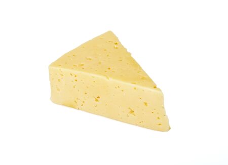The piece of cheese is isolated on a white backgroundの写真素材