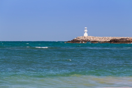 Lighthouse and clear turquoise sea in daytimeの写真素材