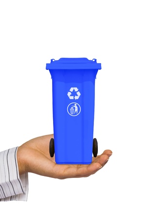 Hand offer blue trash can  garbage bin  with recycle mark, isolated on white backgroundの写真素材