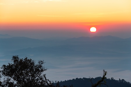 Tropical mountain ranges in the mist at sunrise, northern Thailandの写真素材