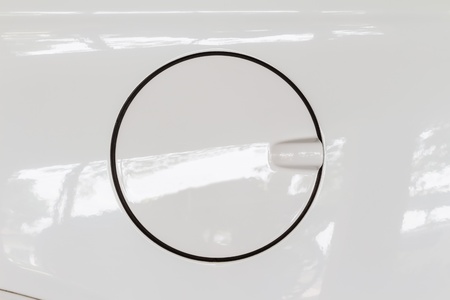 Close up of petrol cap cover on modern white car, a protection device of carの写真素材