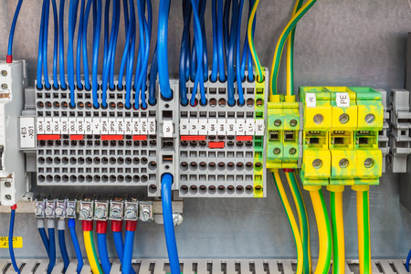 Terminal blocks for electrical connection and earthing terminals for grounding in the control...