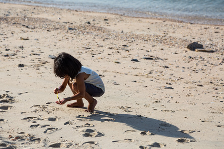 CHONBURI, THAILAND -04 JULY 2015 - Unidentified girl has fun with herself on beach at Ko Sichang Island, Thailand.のeditorial素材