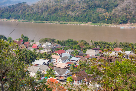 LUANG PRABANG, LAOS - FEBRUARY 22, 2015 - Rooftop view of downtown Luang Prabang city and Mekong river.のeditorial素材