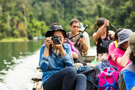 SURAT THANI, THAILAND - 12 SEPTEMBER 2015 - Unidentified tourists take photo from bamboo raft while travel on bamboo raft in Cheow Lan reservoir in Surat Thani province, Thailand.のeditorial素材