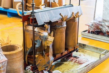 Damage three phase oil immersed transformer showing damage on the core and coilsの写真素材