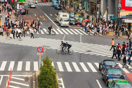 TOKYO, JAPAN - 12 OCTOBER 2016 - Many unidentified Japanese pedestrians start crossing the road at the busiest crosswalk in front of Shibuya station, Tokyo, Japan.のeditorial素材