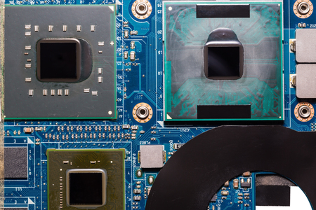 Close up of CPU (central processing unit), GPU (Graphics processing unit) and chipset on laptop motherboard without heat sinksの写真素材