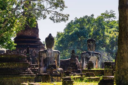 Back view of old seated buddha at Wat Phra Kaeo in Kamphaeng Phet Historical Park, Kamphaeng Phet province, Thailandの写真素材