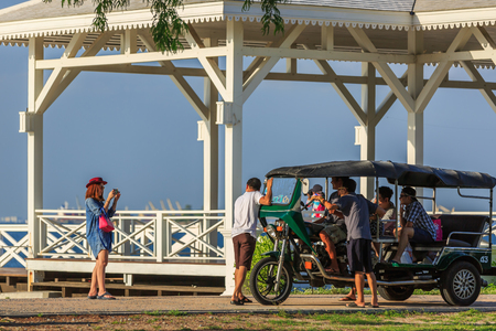 CHONBURI, THAILAND - 04 JULY 2015 - Unidentified tourists take picture of themselves with Tuk-tuk beside the Asdang bridge on Ko Sichang.のeditorial素材
